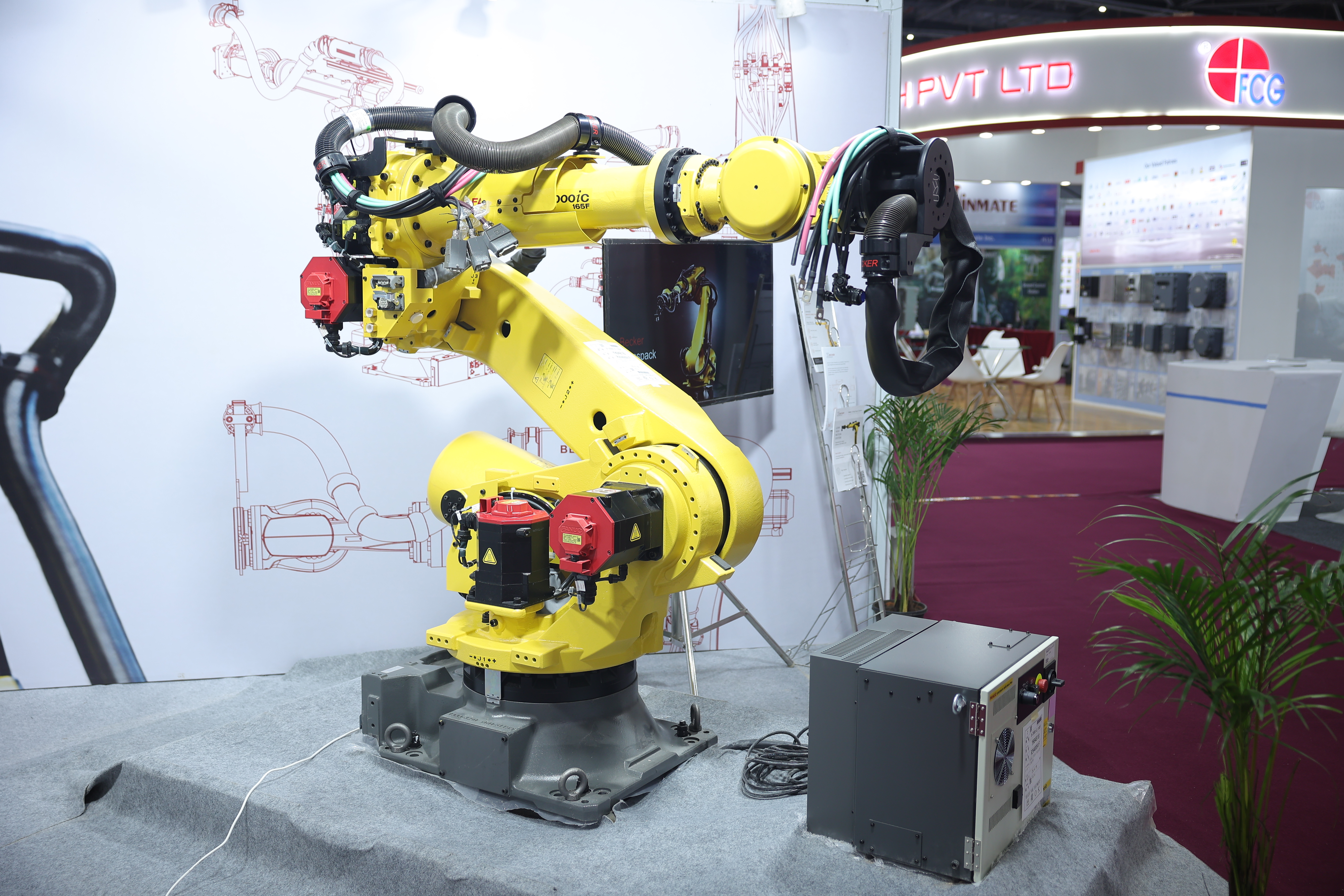 Industrial robotic arm performing precision work at a past Automation Expo